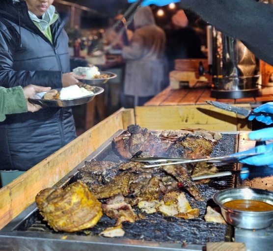 Food being prepared over an open grill